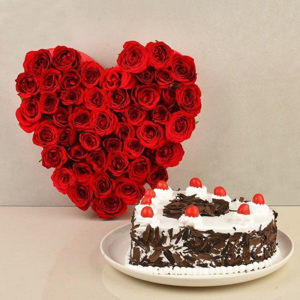 Heart Shaped Arrangement of 50 Red Roses - 1 Kg Heart Shape Black Forest Cake - Spotlight Heart Shaped Arrangement of 50 Red Roses - 1 Kg Heart Shape Black Forest Cake - Spotlight
